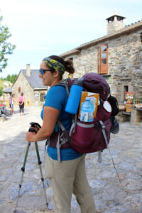 Pilgrim Suzie Greenman of New York pauses for a moment in O Cebreiro, cresting one of the last major peaks before Santiago.