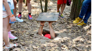 Tourists explore the tunnels at Cu Chi.