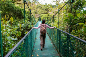 Girl on hanging bridge in cloudforest - Monteverde, Costa Rica